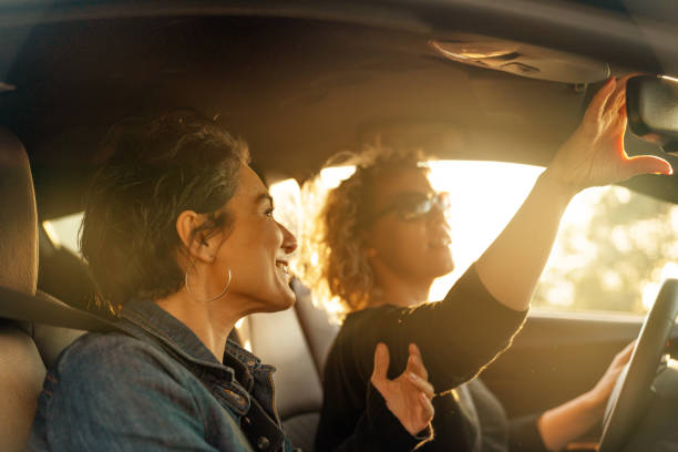istock Two Young Women Driving Car and Having Fun 1137635541