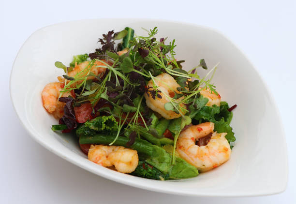 istock poach prawns and green leaves salad 1137639063