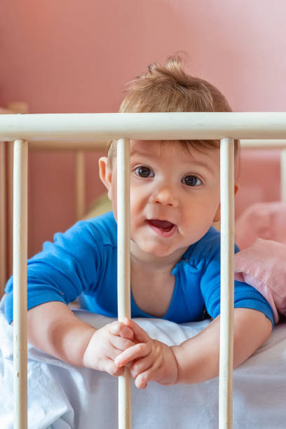 istock Baby boy in his crib 1137640970