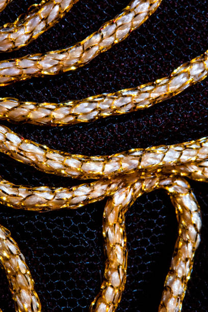 istock Gold Stitching lines on Black Background 1137640994