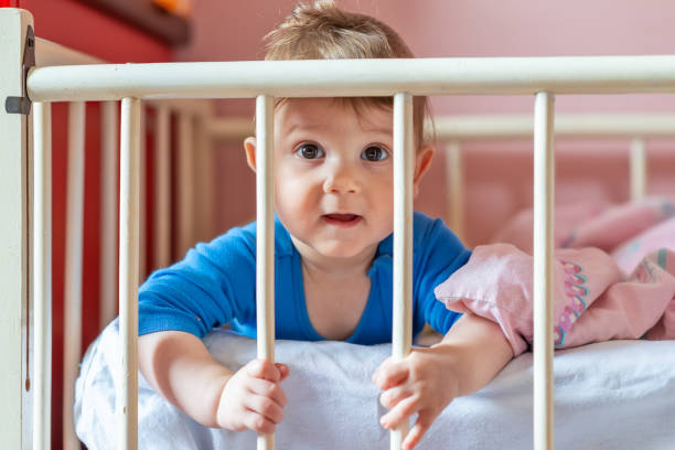 istock Baby boy in his crib 1137641002