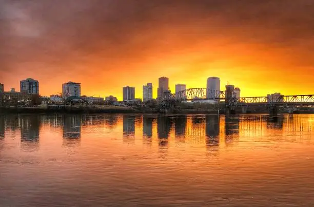 A late fall sunset against a city skyline