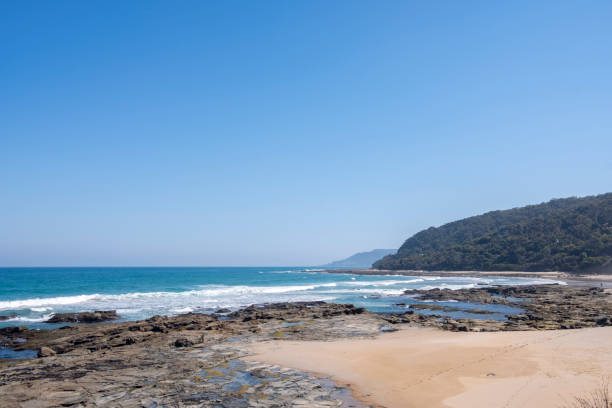 istock Summer Concept: Rocky Shore and Ocean Waves Shot on a Summer Day 1137645397