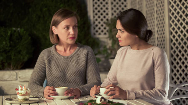 istock Upset female friends looking each other, difference opinion, relations conflict 1137646323