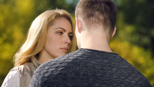 istock Upset woman looking at man, apologizing after quarrel, misunderstanding problem 1137646713