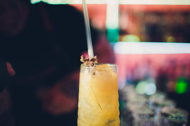istock yellow cocktail, sparkles inside the juice greens on top. 1137648487