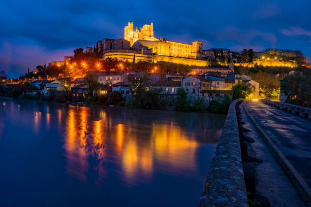 Cathedral and Pont Vieux at night. Beziers Cathedral and Pont Vieux at night. Beziers, southern France. Beautiful night illumination of medieval architecture. beziers stock pictures, royalty-free photos & images