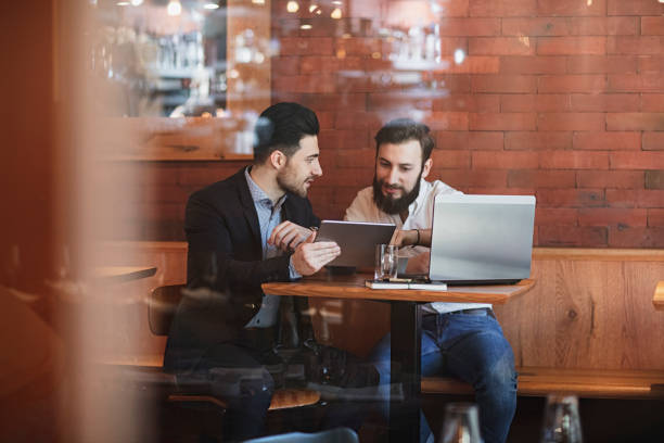 istock two Businessmen talking in restaurant 1137648675