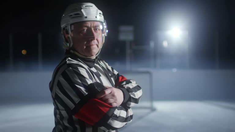 Portrait of Hockey Referee Holding Puck