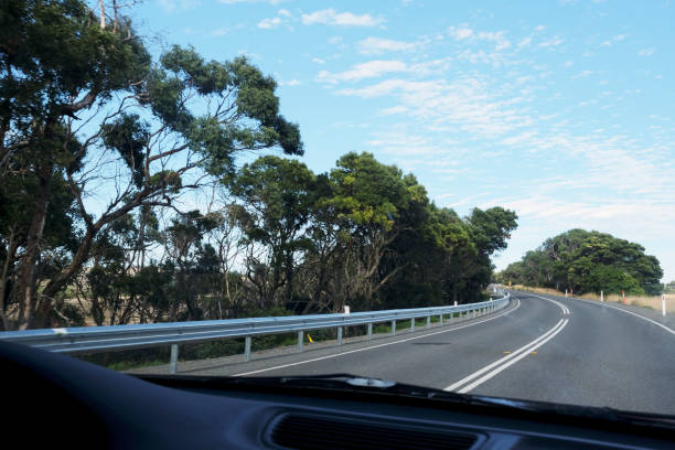 istock Road View and Dashboard Shot from Inside a Car 1137654146