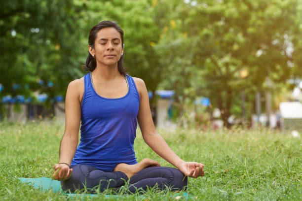 istock Young woman breathing in yoga pose 1137656476