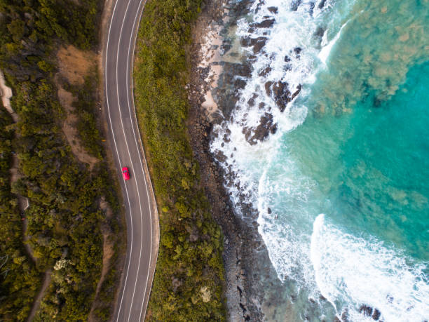 Great Ocean Road, Victoria Aerial Aerial photograph of a car driving on the Great Ocean Road, Victoria. great ocean road photos stock pictures, royalty-free photos & images