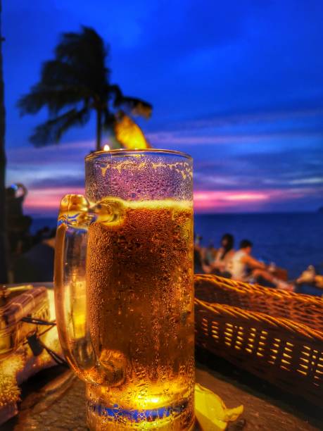 istock Beer on sunset bar with beautiful sunset view. 1137657484