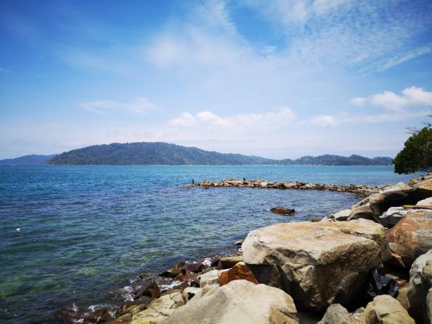 istock Calm sea shore on sunny day. 1137659032