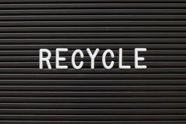 istock Black color felt letter board with white alphabet in word recycle background 1137670575