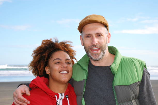 istock Happy Smiling Couple at Beach 1137673989