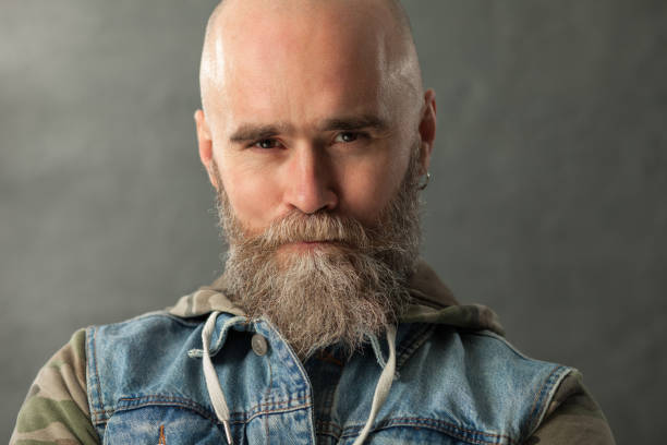 istock Studio portrait of a 40 year old bearded man on a gray background 1137682672