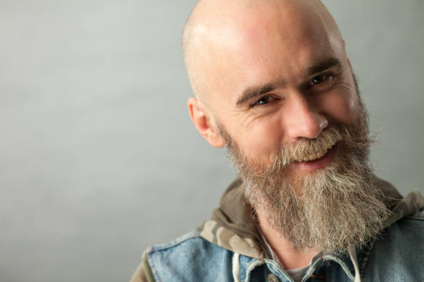 istock Studio portrait of a 40 year old bearded man on a gray background 1137682683