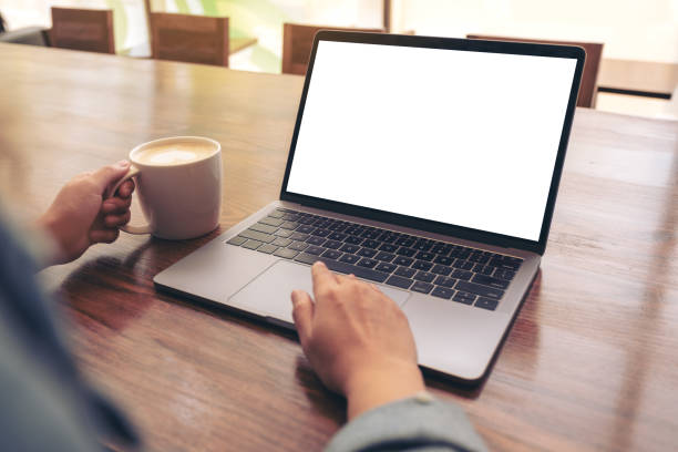 istock a woman using and touching on laptop touchpad with blank white desktop screen 1137683385