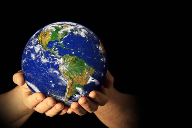 istock Hands holding the Earth with North America visible 1137683421
