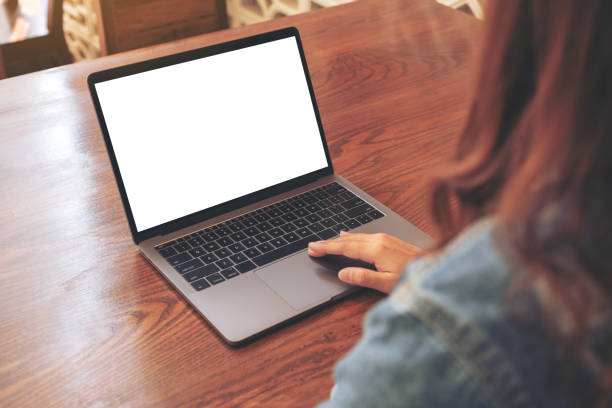 istock a woman using and touching on laptop touchpad with blank white desktop screen 1137683541