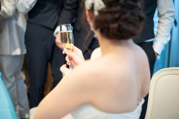 istock Back view of bride toasting wedding 1137684448