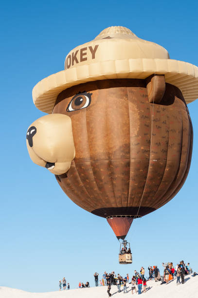 Albuquerque, New Mexico - USA - Oct 13, 2023: Several special shaped hot air balloons fly over the field at the Albuquerque International Balloon Fiesta