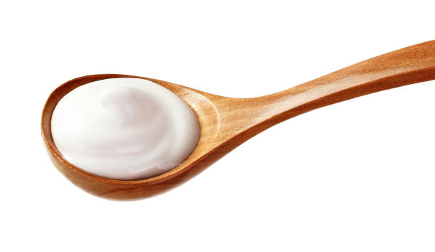 istock cream sour in a spoon isolated white backround 1137697452