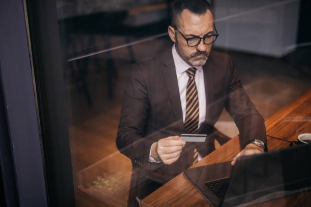 istock Senior businessman shopping online 1137701944