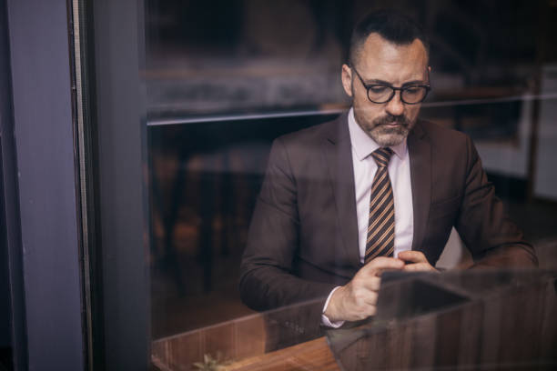 istock Serious senior businessman working 1137703237