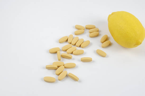 istock Close-Up Of Lemon And Medicines Over White Background 1137706901