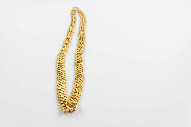 istock High Angle View Of Gold Chain Against White Background 1137707067