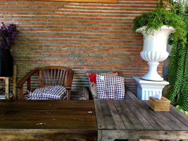 istock Wooden Table Against Brick Wall 1137713205