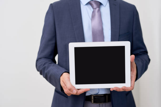 istock Product presentation. Promotion. Business man holding in hands tablet computer with blank screen, close up. 1137717484