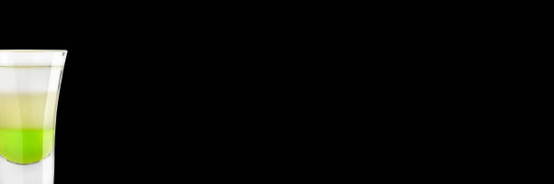 istock Alcoholic shot green mexican on a black background. Place for text. Banner. 1137721506