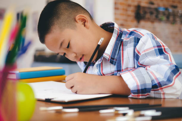 istock Child boy drawing picture at home. 1137721563