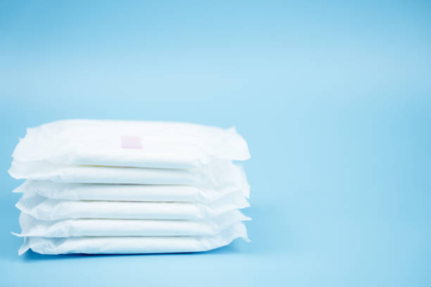 istock Stacked sanitary napkin pad on blue background. 1137723933