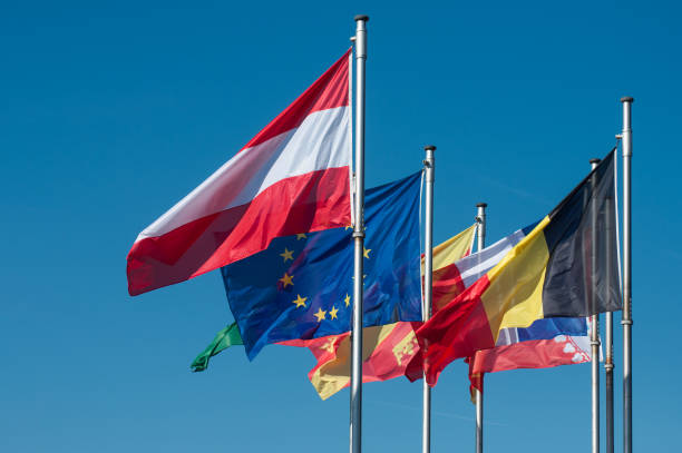 istock european flags on blue sky background 1137724110