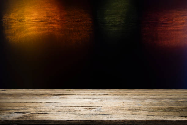 istock Wooden table with blur night bokeh background. 1137725139