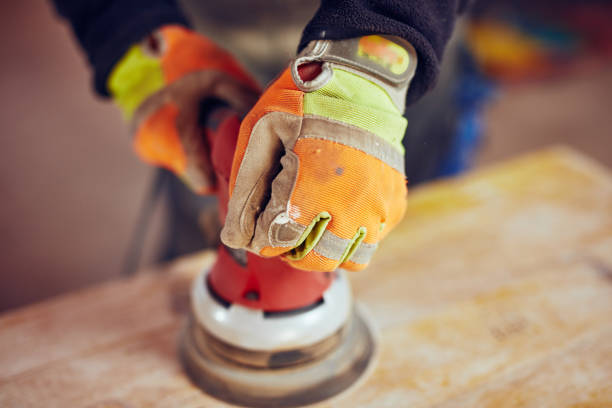istock Male carpenter using orbital electric sander in a retro vintage workshop. 1137726076