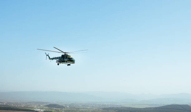 istock A military helicopter flying over the village 1137728475
