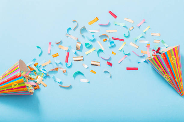 istock birthday hat with confetti on paper background 1137728504
