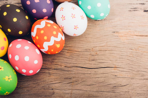 istock Beautiful Easter multi color egg on wooden 1137729243