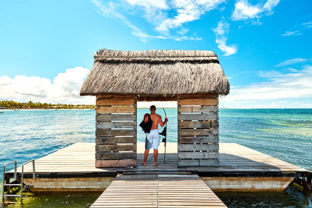 Jetty with man silhouette on pontoon in Mauritius Island