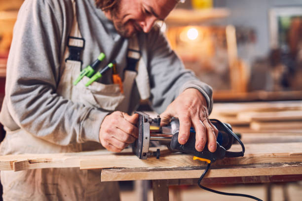 istock Male carpenter working on old wood in a retro vintage workshop. 1137729794