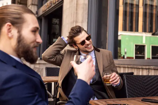 Business break - Two young businessmen taking a break in Central London