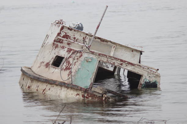 istock Old ruined boat sinking in river water 1137732468