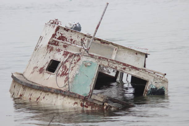 istock Old ruined boat sinking in river water 1137732646