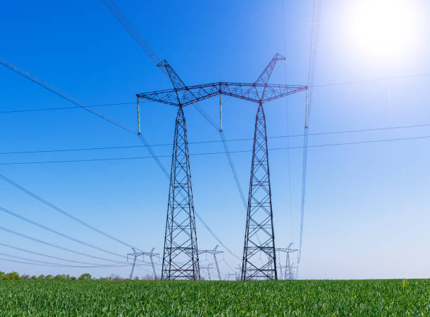 istock A high voltage power pylons in the green wheat field 1137734381