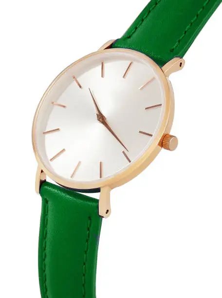 Classic women's gold watch with white dial, green leather strap, isolate on a white background. Isometric view.